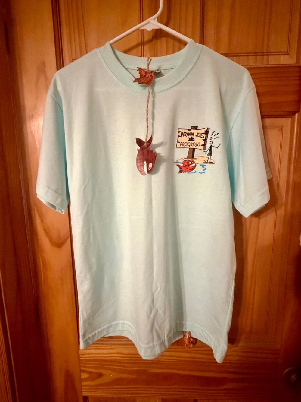 Light Aqua Graphic Tee with Small Chest Illustration